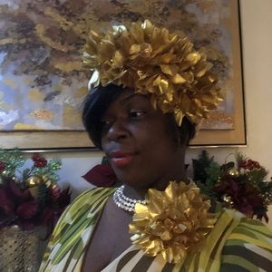 Gold headband and flower.